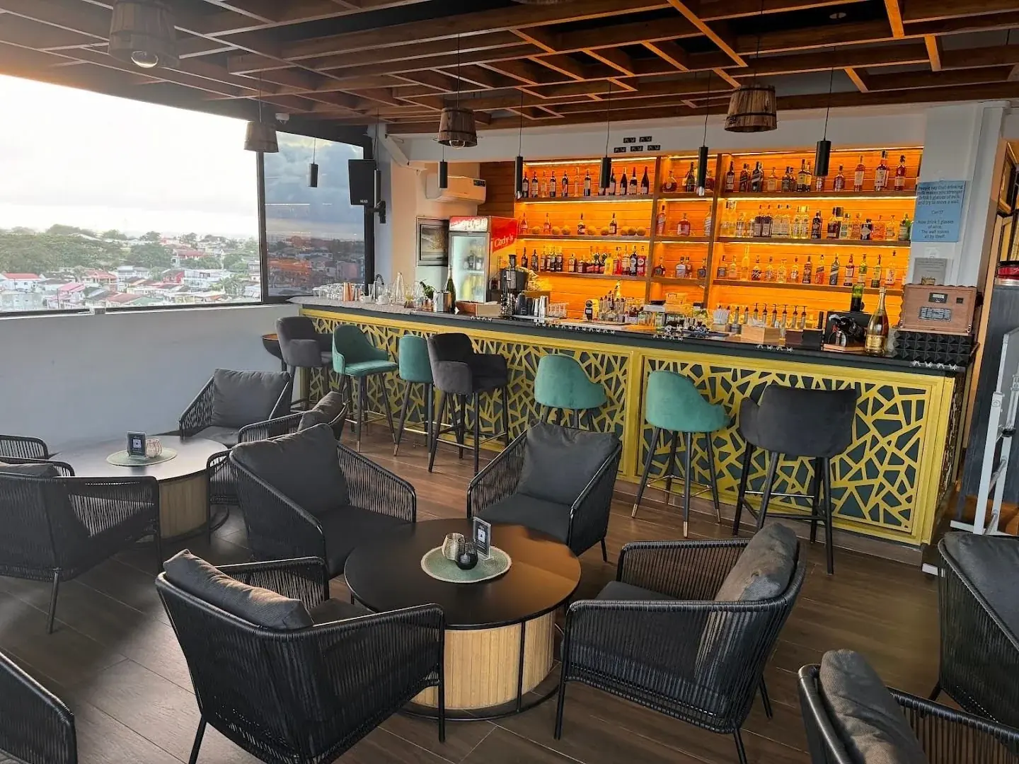 Skyline rooftop seating with a daytime view across Abidjan